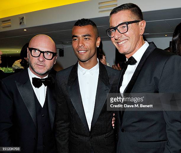 Domenico Dolce, Ashley Cole and Stefano Gabbana arrive at the GQ Men Of The Year Awards 2012 at The Royal Opera House on September 4, 2012 in London,...