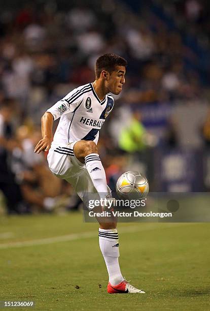 Hector Jimenez of the Los Angeles Galaxy controls the ball during the MLS match against the Vancouver Whitecaps at The Home Depot Center on September...