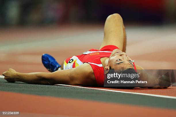 Mian Che of China falls down after competing in the Men's 400m ¿ T36 final on day 6 of the London 2012 Paralympic Games at Olympic Stadium on...