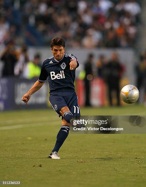 John Thorrington of the Vancouver Whitecaps crosses in the first half during the MLS match against the Los Angeles Galaxy at The Home Depot Center on...