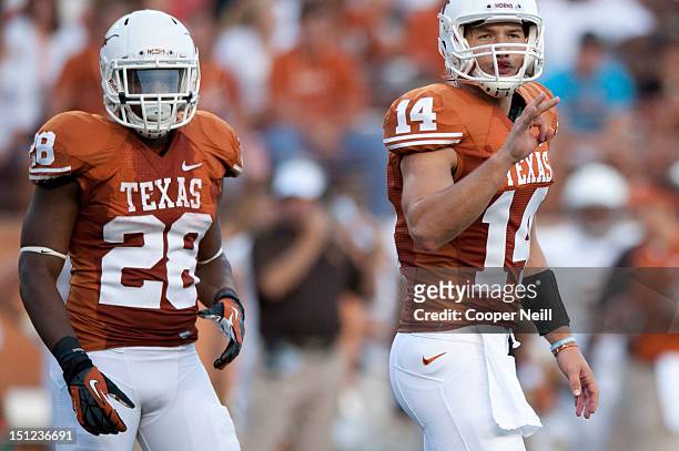 David Ash of the Texas Longhorns and running back Malcolm Brown look to the sideline against the University of Wyoming Cowboys on September 1, 2012...