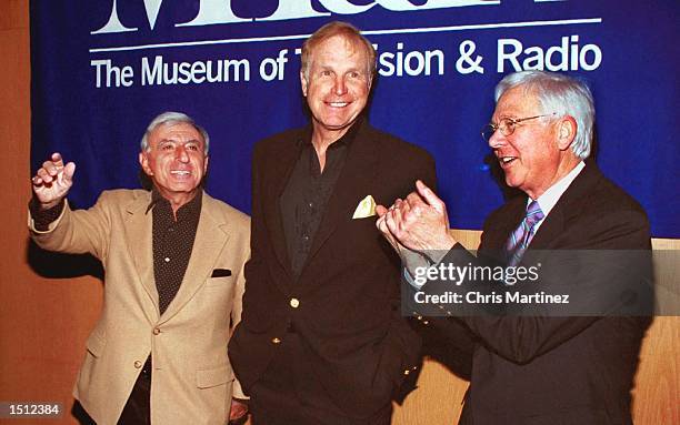 Los Angeles, CA. Actor Wayne Rogers is caught between gestures by his former cast members Jamie Farr and William Christopher of the popular...