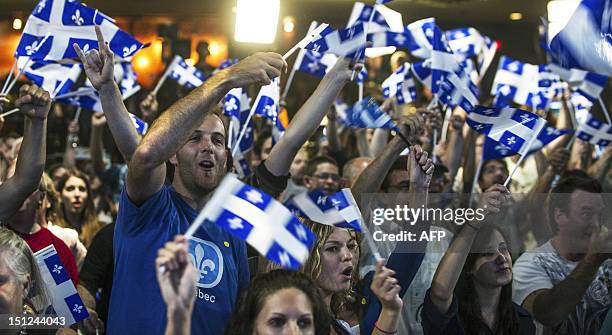 Supporters of Parti Québécois leader Pauline Marois cheer election results on September 4, 2012 in Montreal, as voters in Canada's Quebec province...