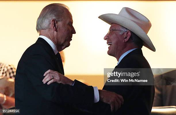 Vice President Joe Biden greets Secretary of the Interior Ken Salazar during day one of the Democratic National Convention at Time Warner Cable Arena...