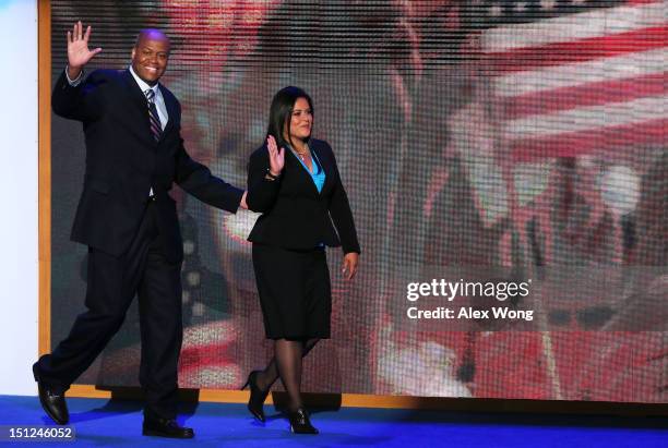 First lady Michelle Obama's brother Craig Robinson and U.S. President Barack Obama's sister Dr. Maya Kassandra Soetoro-Ng take the stage during day...