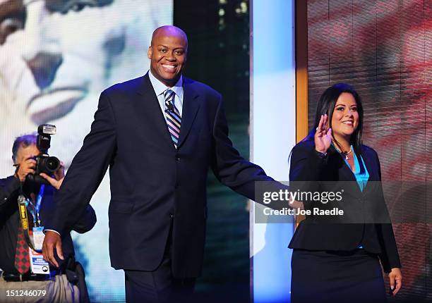 First lady Michelle Obama's brother Craig Robinson and U.S. President Barack Obama's sister Dr. Maya Kassandra Soetoro-Ng walk on stage during day...