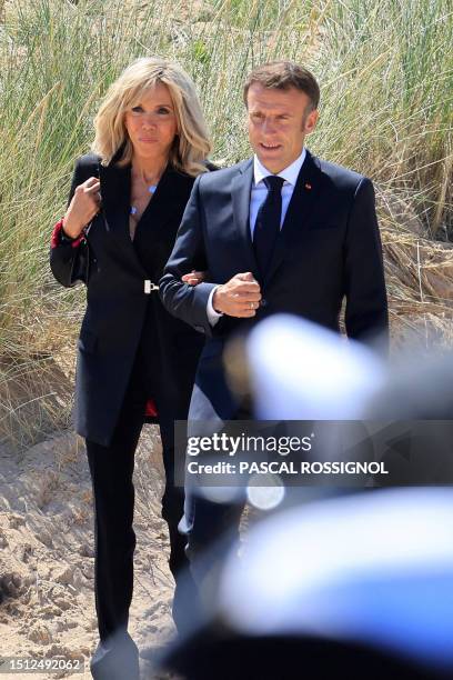 French President Emmanuel Macron and his wife Brigitte Macron arrive to attend a national tribute to late Leon Gautier, French WWII veteran and the...