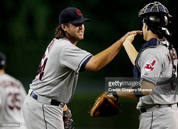 Chris Perez of the Cleveland Indians celebrates a 3-2 win over the Detroit Tigers with Lou Marson at Comerica Park on September 4, 2012 in Detroit,...