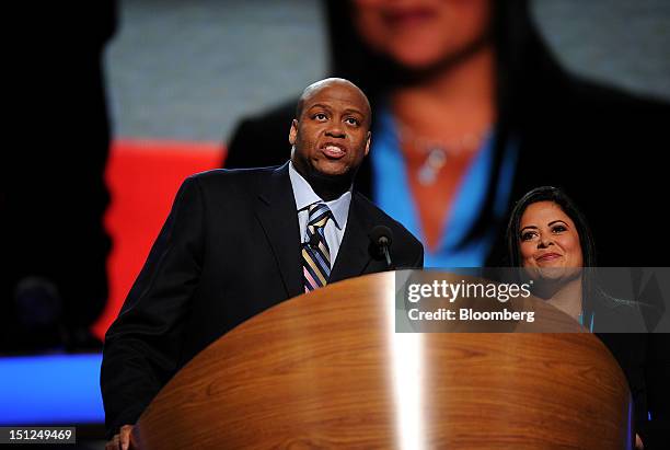 Craig Robinson, brother of First Lady Michelle Obama, left, speaks while Maya Soetoro-Ng, sister of U.S. President Barack Obama, listens at the...