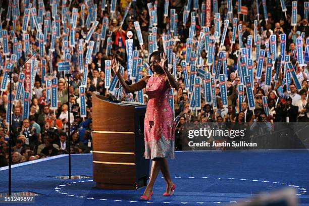 First lady Michelle Obama waves on stage after speaking during day one of the Democratic National Convention at Time Warner Cable Arena on September...