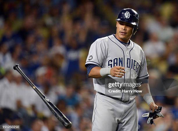 Everth Cabrera of the San Diego Padres tosses his bat in reaction to his strikeout to end the fourth inning against the Los Angeles Dodgers at Dodger...