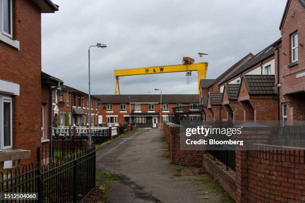 One of the iconic Harland & Wolff Samson and Goliath yellow gantry cranes on the skyline above a residential area in East Belfast, Northern Ireland,...
