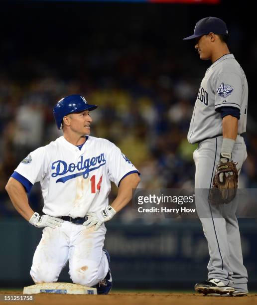 Mark Ellis of the Los Angeles Dodgers reacts to Everth Cabrera of the San Diego Padres after his double during the seventh inning at Dodger Stadium...