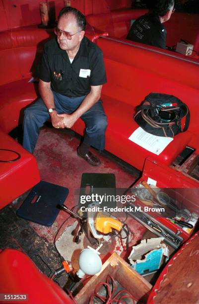 Locksmith Walt "Marty" Martin takes a break from drilling open a safe May 24, 2000 at the Formosa Cafe in Los Angeles, CA. The safe belonged to...