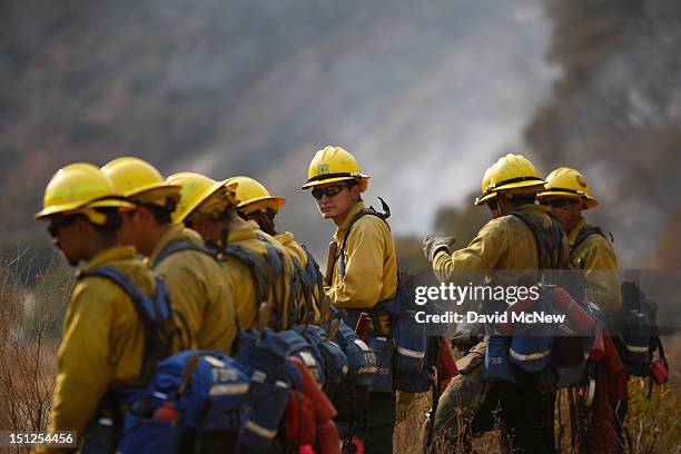 Forest Service firefighters watch for spots at the Williams fire in the Angeles National Forest on September 4, 2012 north of Glendora, California....