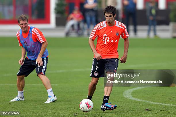 Bastian Schweinsteiger battles for the ball with his team mate Javier Martínez during a FC Bayern Muenchen training session at the Saebener Strasse...