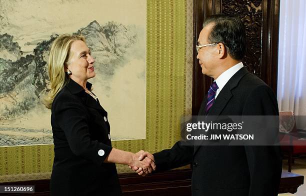 Secretary of State Hillary Clinton shakes hands with Chinese Premier Wen Jiabao during their bilateral meeting at the Zhongzanhai Leadership Compound...