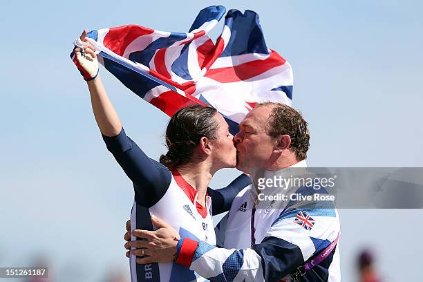 Sarah Storey of Great Britain celebrates with husband Barney after winning the Women's Individual Time Trial - C5 on day 7 of the London 2012...