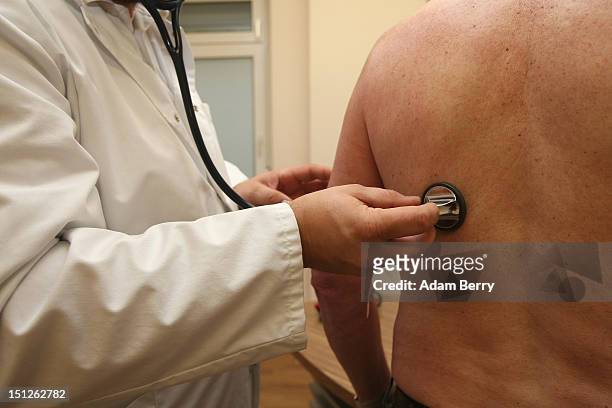 Doctor uses a stethoscope on a patient on September 5, 2012 in Berlin, Germany. Doctors in the country are demanding higher payments from health...