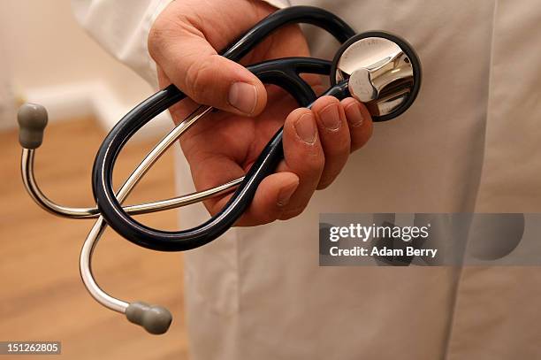 Doctor holds a stethoscope on September 5, 2012 in Berlin, Germany. Doctors in the country are demanding higher payments from health insurance...
