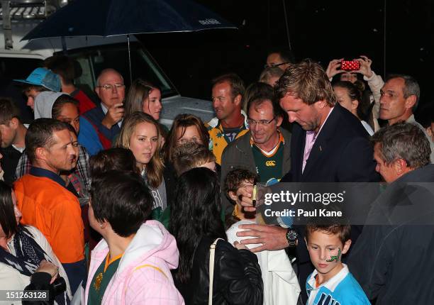 Andries Bekker of the Springboks signs autographs for fans during the Big Braai at Northbridge Piazza on September 5, 2012 in Perth, Australia.