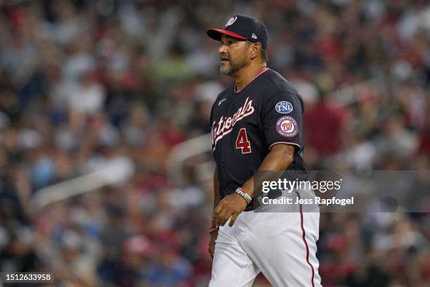 Manager Dave Martinez of the Washington Nationals walks to the mound to make a pitching change against the Cincinnati Reds in the eighth inning at...