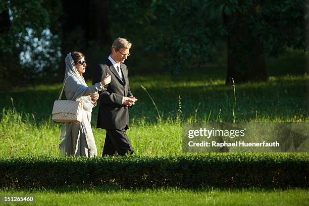 German Foreign Minister Guido Westerwelle talks with Pakistan Foreign Minister Hina Rabbani Khar in the garden of the Villa Borsig in Berlin on...