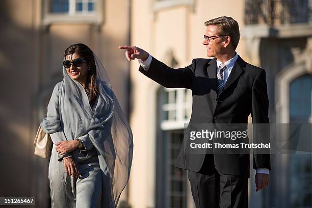 German Foreign Minister Guido Westerwelle talks with Pakistan Foreign Minister Hina Rabbani Khar in the garden of the Villa Borsig in Berlin on...