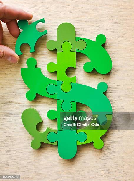 dollar currency sign puzzle, last piece positioned - currency symbols stock pictures, royalty-free photos & images