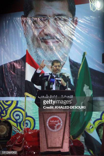 Egyptian head of the Muslim Brotherhood's Freedom and Justice Party and presidential candidate, Mohammed Mursi, addresses supporters during an...