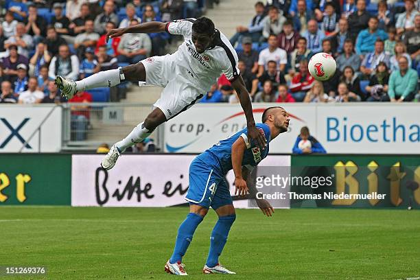 Stephan Schroeck of Hoffenheim fights for the ball with Olivier Occean of Frankfurt during the Bundesliga match between 1899 Hoffenheim and Eintracht...