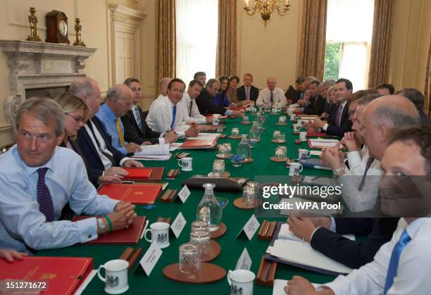 Britain's Prime Minister David Cameron chairs the first cabinet meeting following a ministerial re-shuffle, with Environment Secretary Owen Paterson,...