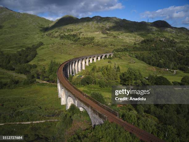 An aerial view of the Glenfinnan Viaduct in Scotland, which became famous tourist attraction center after the Harry Potter movies and where the...