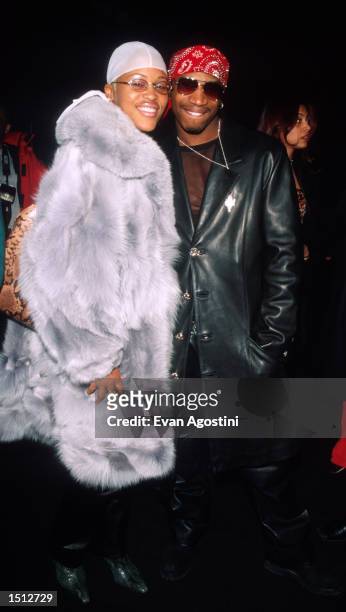 Ruff Ryders'' Eve and DJ Stevie K pose for photographers at the Luca Luca Fall/Winter 2000 fashion show February 6, 2000 in New York City.