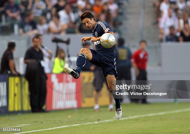 John Thorrington of the Vancouver Whitecaps volleys a pass in the first half during the MLS match against the Los Angeles Galaxy at The Home Depot...