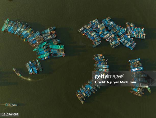 abstract aerial image of many fishing boats parked together at tho quang fishing port, da nang city - han river imagens e fotografias de stock