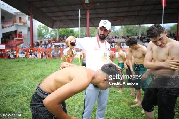 Wrestler boys get their bodies oiled ahead of the 662nd Kirkpinar Oil Wrestling Festival in Edirne, Turkiye on July 07, 2023. During the festival 141...