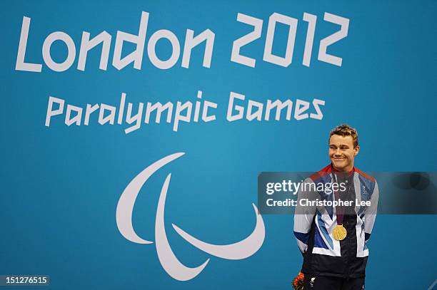 Gold medallist Oliver Hynd of Great Britain poses on the podium during the medal ceremony for the Men's 200m Individual Medley -SM8 Final on day 7 of...