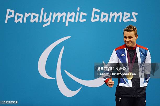 Gold medallist Oliver Hynd of Great Britain poses on the podium during the medal ceremony for the Men's 200m Individual Medley -SM8 Final on day 7 of...