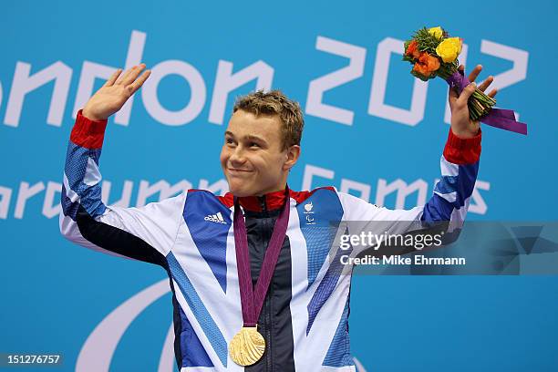 Gold medallist Oliver Hynd of Great Britain celebrates during the medal ceremony for the Men's 200m Individual Medley -SM8 Final on day 7 of the...