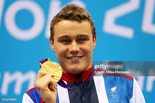 Gold medallist Oliver Hynd of Great Britain poses on the podium during the medal ceremony for the Men's 200m Individual Medley -SM8 Final on day 7 of...