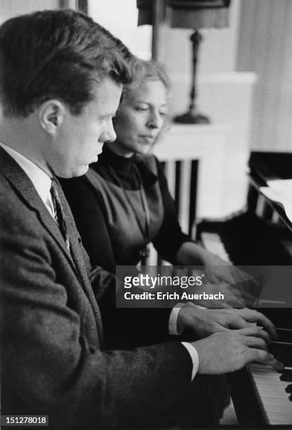 Pianist Yaltah Menuhin playing the piano with her husband Joel Ryce at Emmy Tillett's house at 11 Elm Tree Road, London, 18th October 1962.
