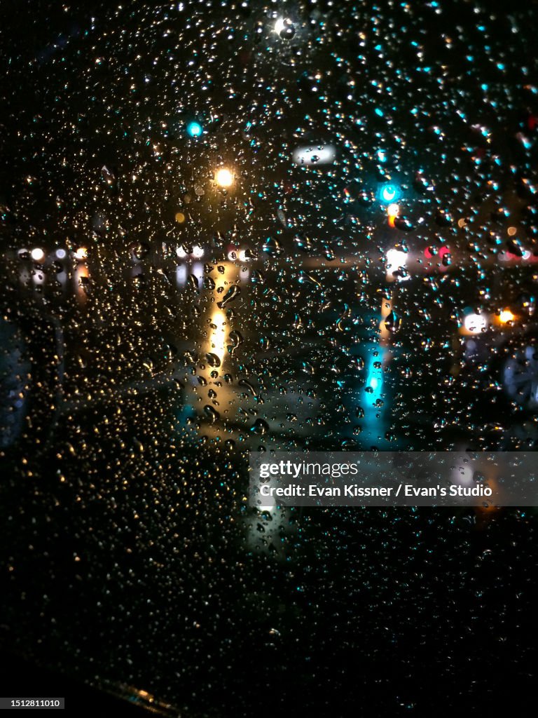 Rainy Night Lights Through Car Window