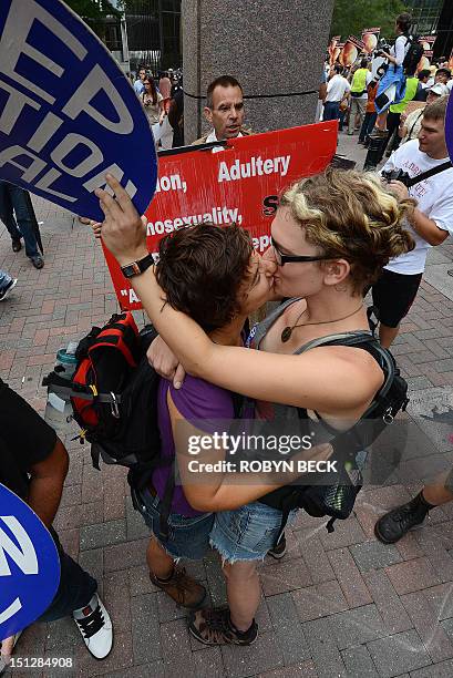 Abortion rights protesters Annah Shapiro and Kat Enyeart , both from Portland, Oregon, kiss in front of street preacher Alan Hoyle on day two of the...