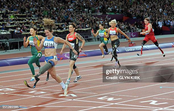 Italy's Martina Caironi finishes ahead of Australia's Kelly Cartwright and Germany's Jana Schmidt to win gold and set a new world record of 15.87 in...