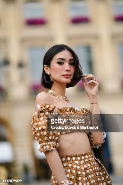 Heart Evangelista wears diamonds large earrings, a pink gold with large stones necklace, a pink gold and diamonds necklace from Bulgari, a white with...