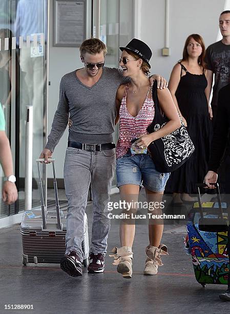 Sarah Connor and Florian Fischer leave Vienna at Airport Vienna on September 5, 2012 in Vienna, Austria.