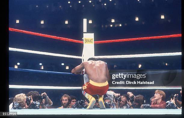 Journalists shoot photos of Leon Spinks between rounds during his fight with Muhammad Ali September 15, 1978 at the Superdome in New Orleans, LA. Ali...