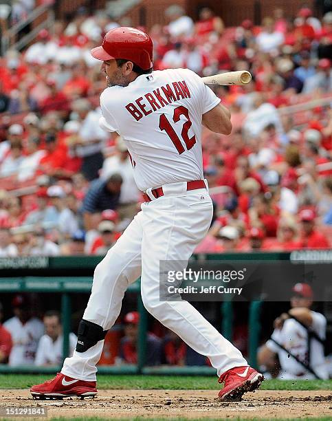Lance Berkman of the St. Louis Cardinals hits a single against the New York Mets at Busch Stadium on September 5, 2012 in St. Louis, Missouri.