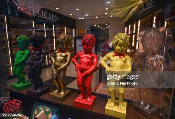 View of a shop window with figurines of the famous Manneken Pis, copies of the emblematic bronze sculpture of the fountain in the center of Brussels,...